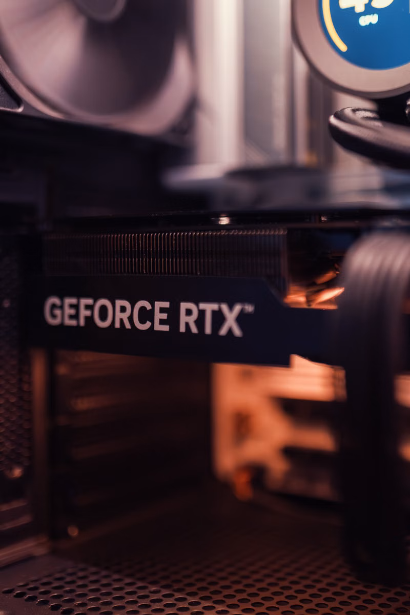 Close-up of a graphics card being installed in a desktop computer