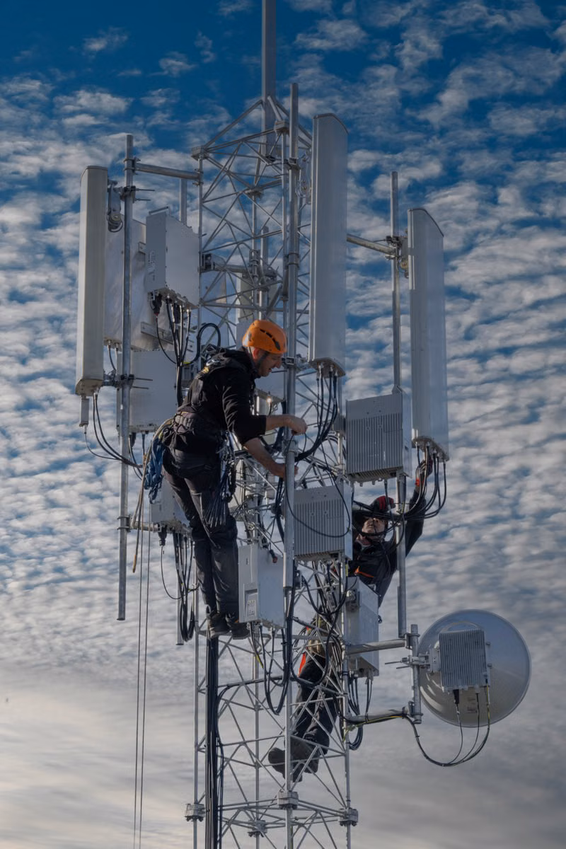 Network technician completing wireless service at a Jacksonville home